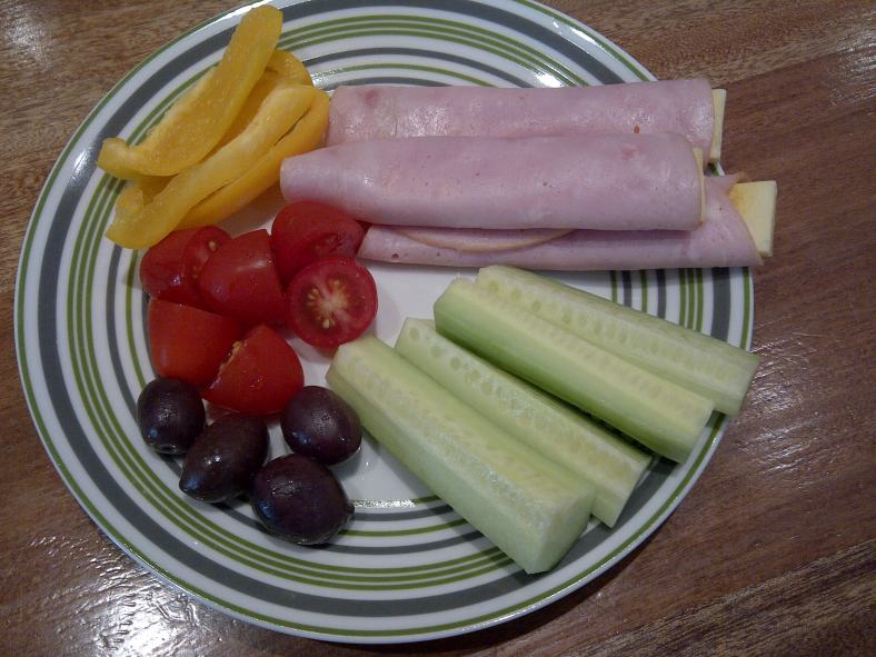 Lunch: Ham and cheese roll-ups, cucumber, tomatoes, yellow pepper and olives