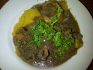 Springbok neck stew with marrow bones on top of gem squash